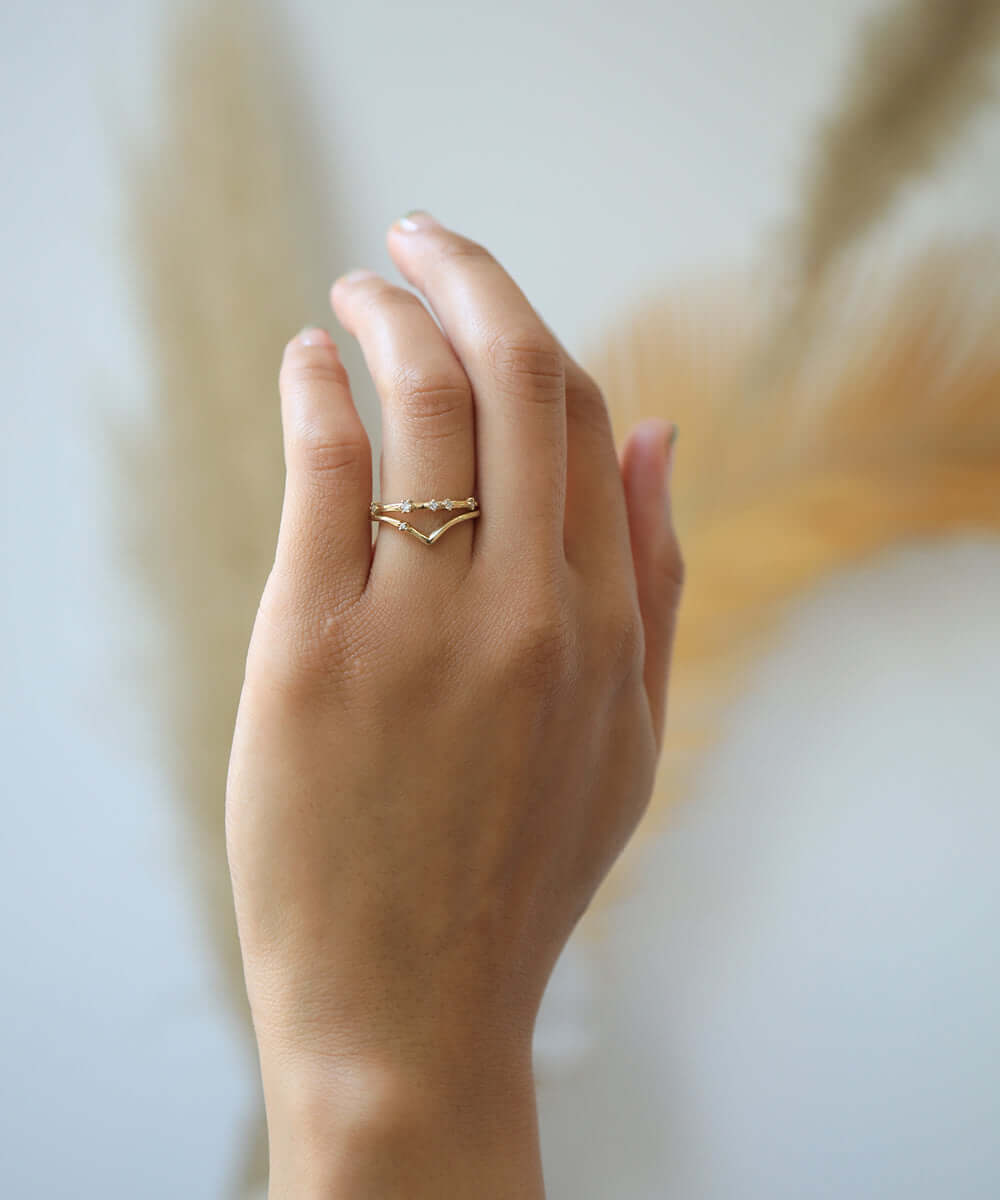 assorted v shaped bands 14k yellow gold diamonds rubies handcrafted macha studio brooklyn new york