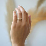 assorted v shaped bands 14k yellow gold diamonds rubies handcrafted macha studio brooklyn new york