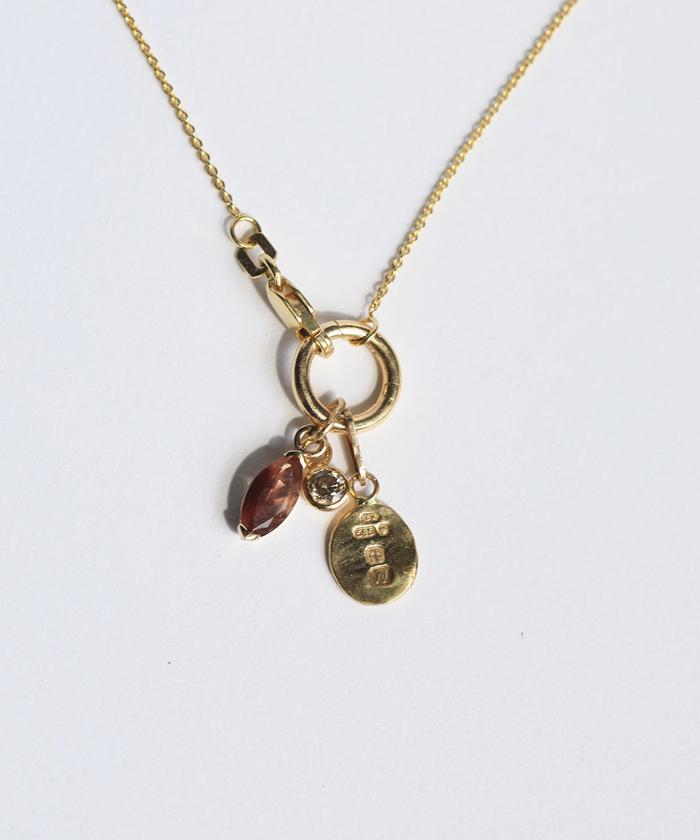 Macha Studio located in Greenpoint Brooklyn NYC Marquise Auburn Sunstone with White Diamond pendant and Hallmarked in London Pendant in 14k Yellow Gold