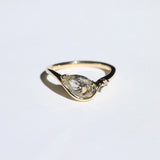 Crest ring with peppery white diamond