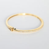 Diamond studded oval bangle