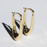 Elongated oval hoops 14k yellow gold Brooklyn New York 11222 