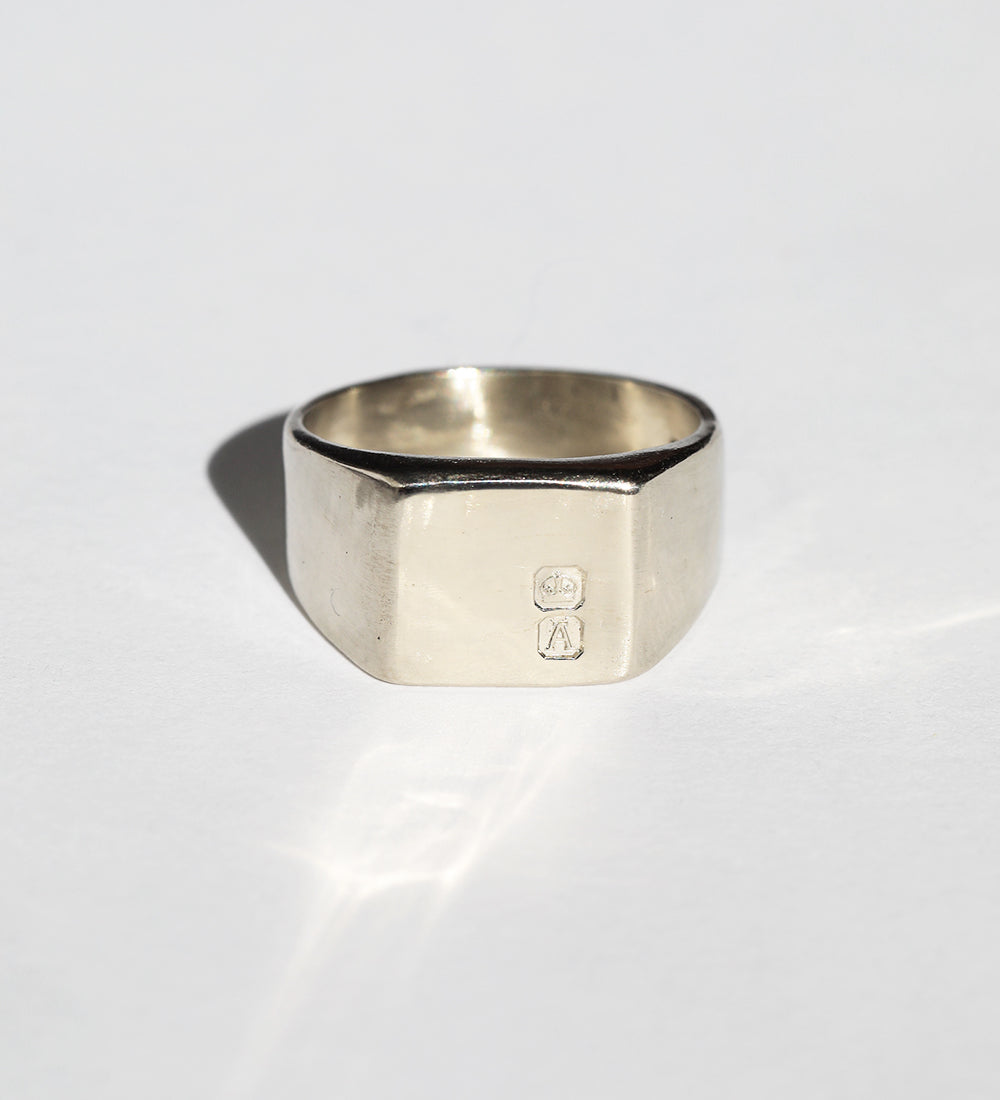 large 14k white gold signet ring featuring British hallmarks and date letter 'w' handcrafted macha studio brooklyn new york