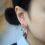 Medium lightweight 14k gold hoops earrings NYC fine jewelry brooklyn NY New York jeweler sustainable ethical greenpoint engagement