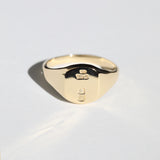 small 14k yellow gold signet ring with rounded square face featuring British hallmarks and date letter 'a' handcrafted macha studio brooklyn new york