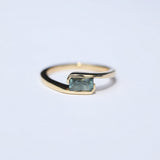 Orbit Ring with Pale Blue Emerald Cut Sapphire