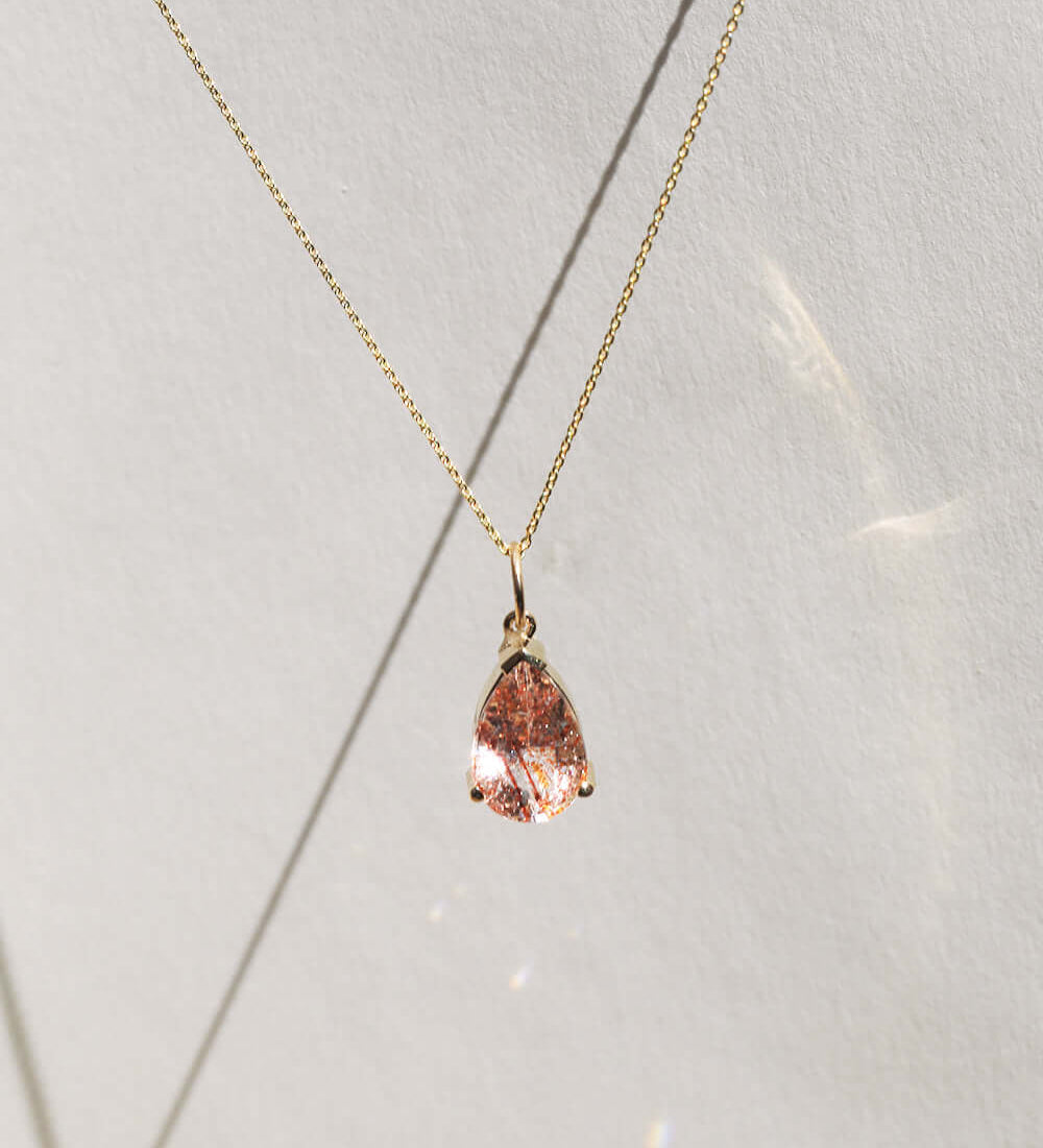 pendent charm 14k yellow gold sunstone NYC fine jewelry brooklyn NY New York jeweler sustainable ethical greenpoint engagement