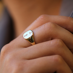 small 14k yellow gold signet ring with rounded square face featuring British hallmarks and date letter 'w' handcrafted macha studio brooklyn new york