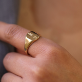 small 14k yellow gold signet ring with rounded square face featuring British hallmarks and date letter 'w' handcrafted macha studio brooklyn new york