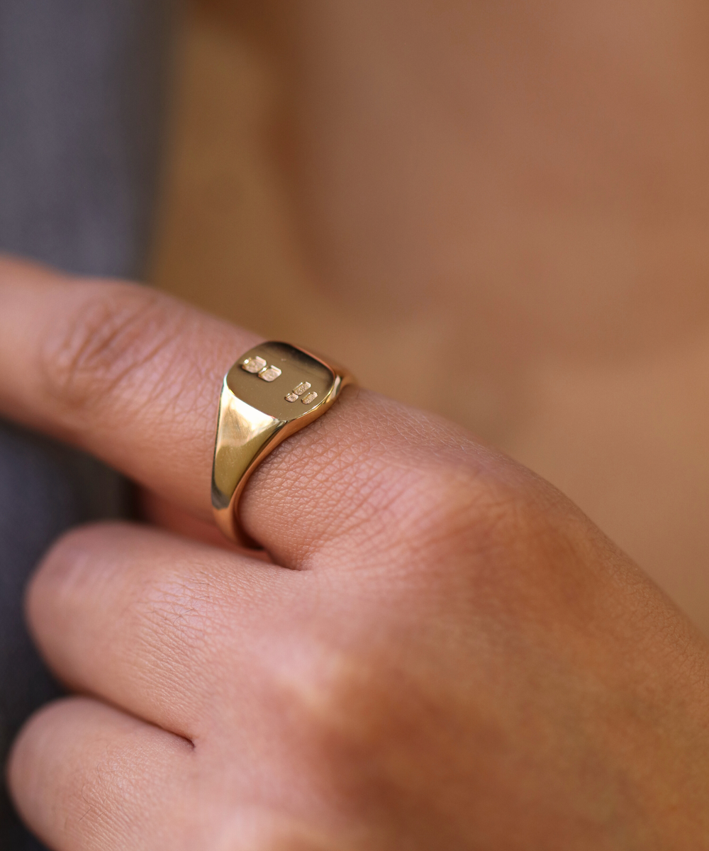 small 14k yellow gold signet ring with rounded square face featuring British hallmarks and date letter 'w' handcrafted macha studio brooklyn new york