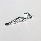 sculptural brooch or lapel pin for weddings, crafted in sterling silver by Macha Studio, Greenpoint, Brooklyn NYC