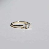 Emerald cut 0.5ct white diamond, with white diamond baguettes set in 14k yellow gold