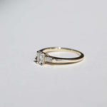 Emerald cut 0.5ct white diamond, with white diamond baguettes set in 14k yellow gold