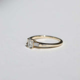 Emerald cut 0.5ct white diamond, with white diamond baguettes set in 14k yellow gold