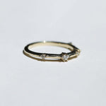 thin 14k yellow gold band with scattered tiny accent white diamonds handcrafted macha studio brooklyn new york