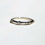 thin 14k yellow gold band with scattered tiny accent white diamonds handcrafted macha studio brooklyn new york