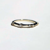 thin 14k yellow gold band with scattered tiny accent white diamonds handcrafted macha studio brooklyn new york