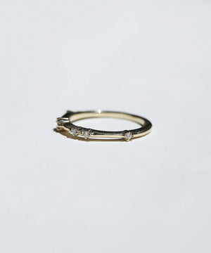 thin 14k yellow gold band with scattered tiny accent white diamonds handcrafted macha studio brooklyn new york