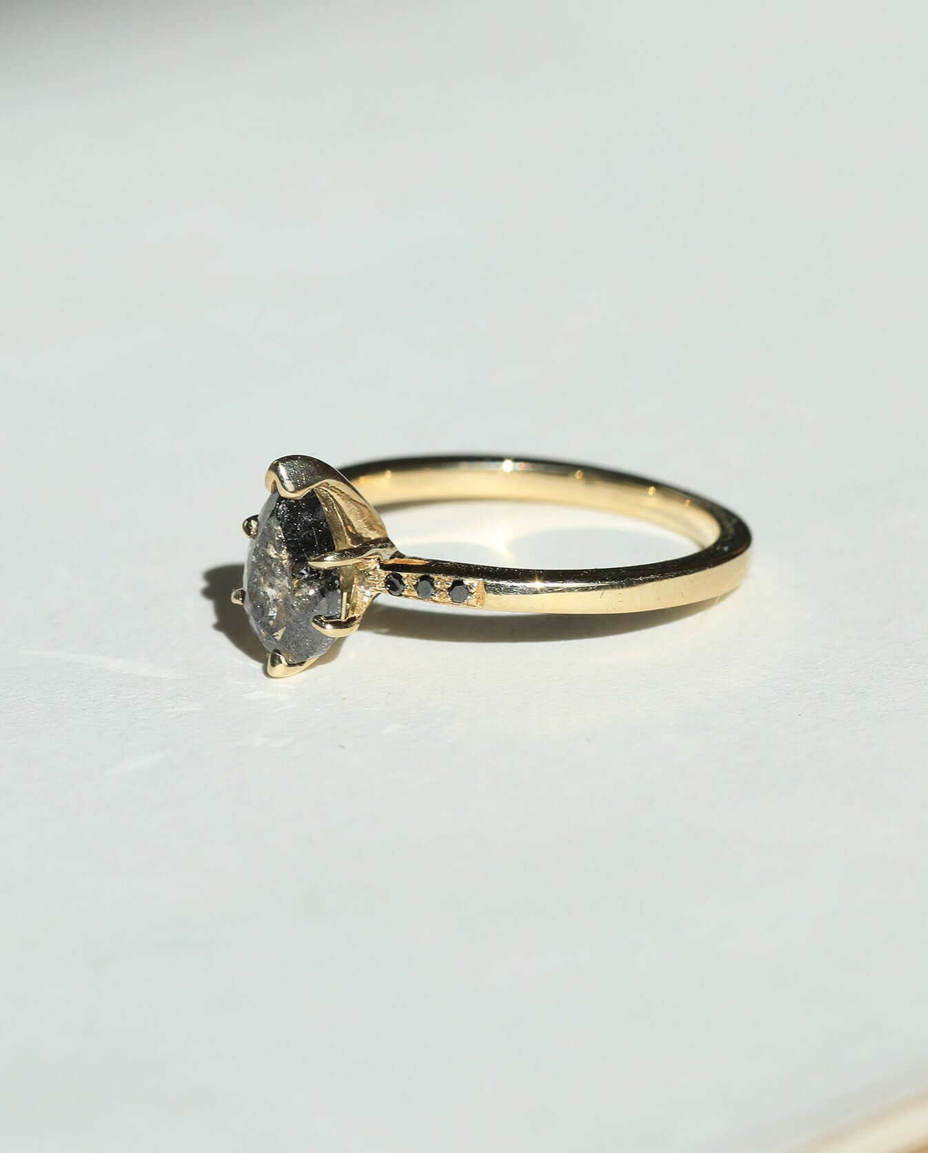 Salt and Pepper Pear shaped Diamond with Black Diamonds claw prong set in 14k Yellow Gold Greenpoint Brooklyn New York City