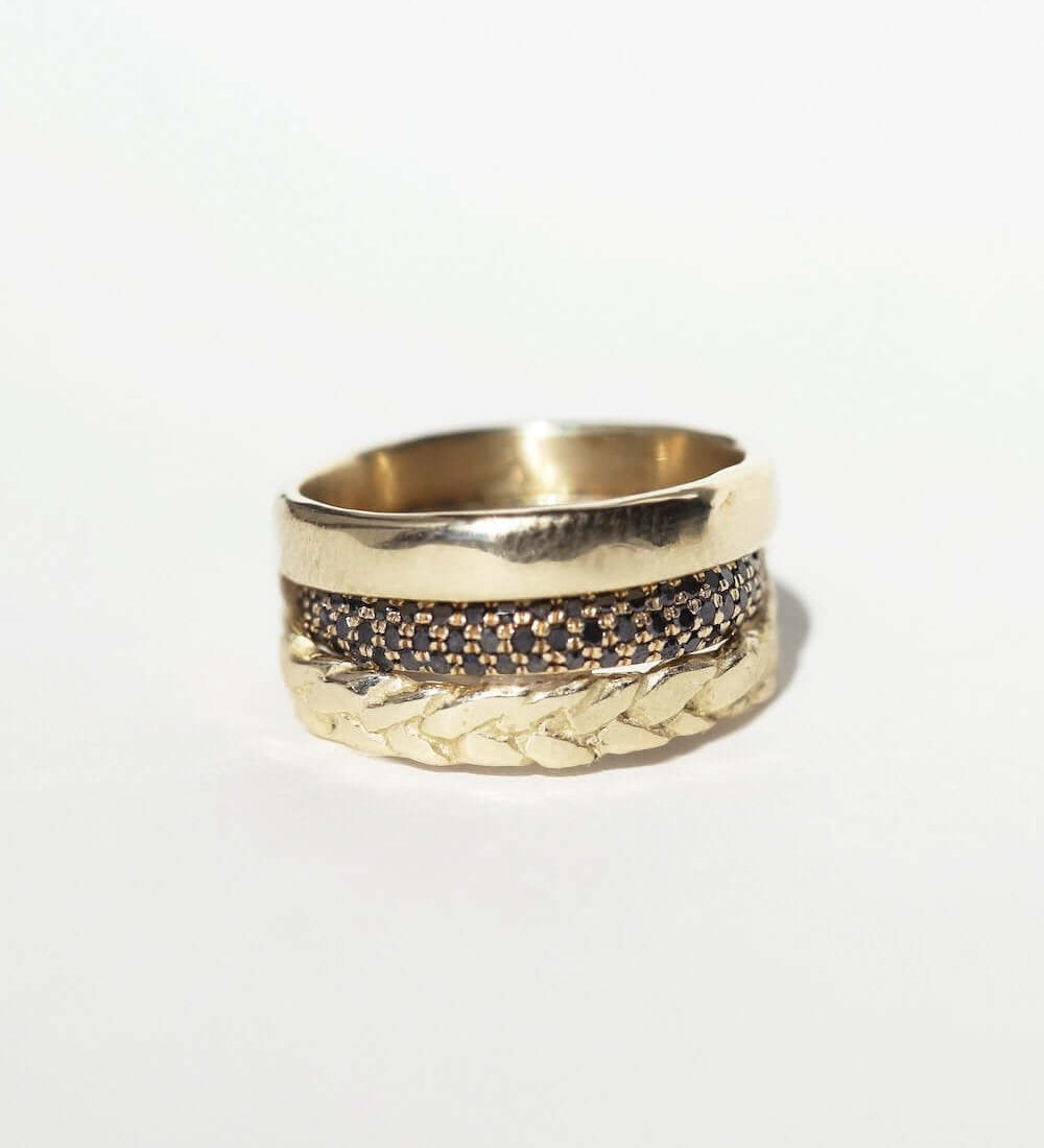 3.5mm Handcrafted Hoop Ring (lightweight), Macha Triple Black Diamond Band in and Caribou Ring all in recycled 14k yellow gold.