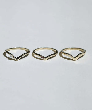 assorted v shaped bands 14k yellow gold diamonds rubies handcrafted macha studio brooklyn new york