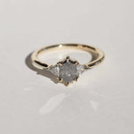 elongated hexagonal cut salt and pepper diamond accented with aligned trillion cut white diamonds, 14k yellow gold, handcrafted by macha studio brooklyn new york