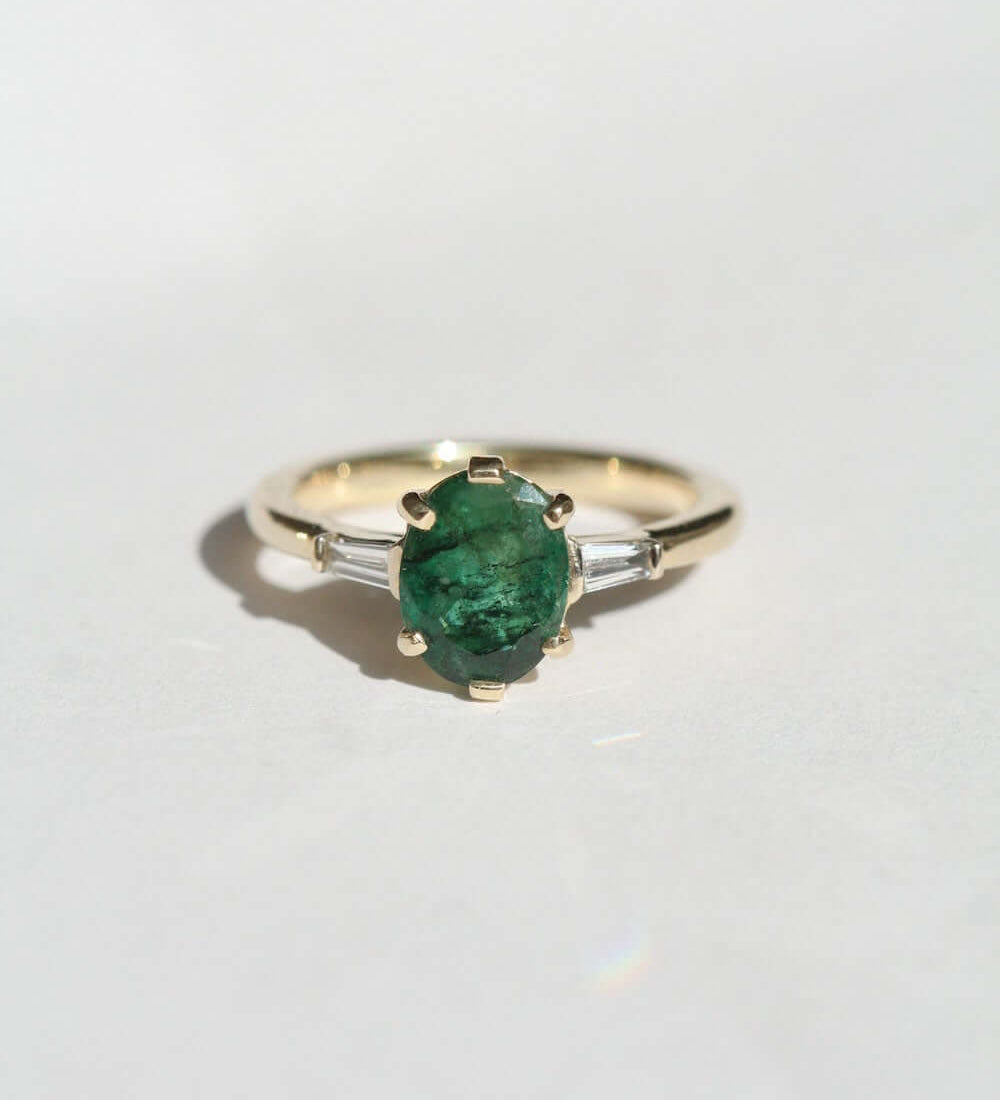Oval Emerald engagement ring set in gold, by Macha Studio, Brooklyn NYC
