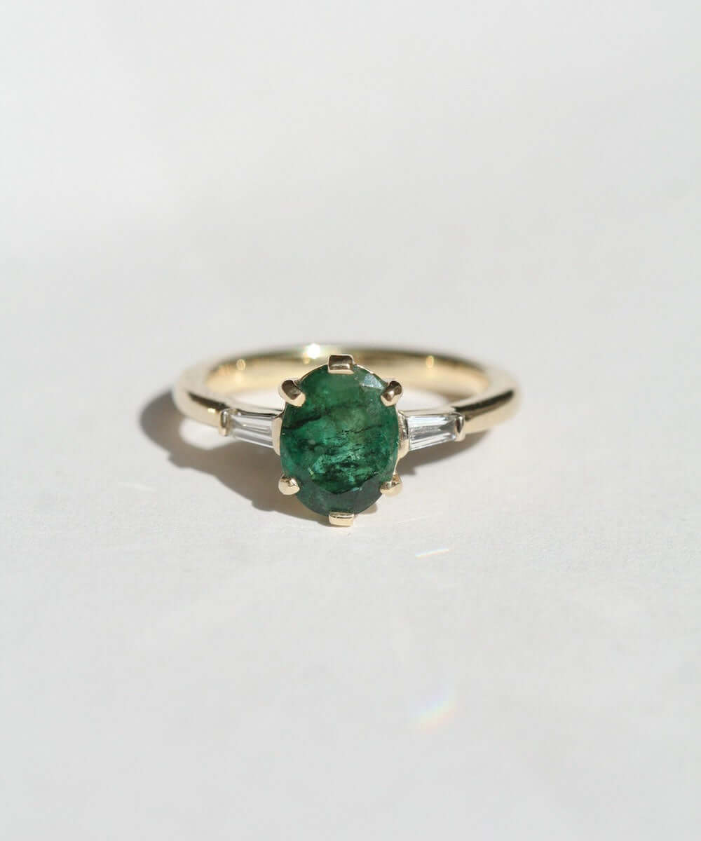 Oval Emerald engagement ring set in gold, by Macha Studio, Brooklyn NYC