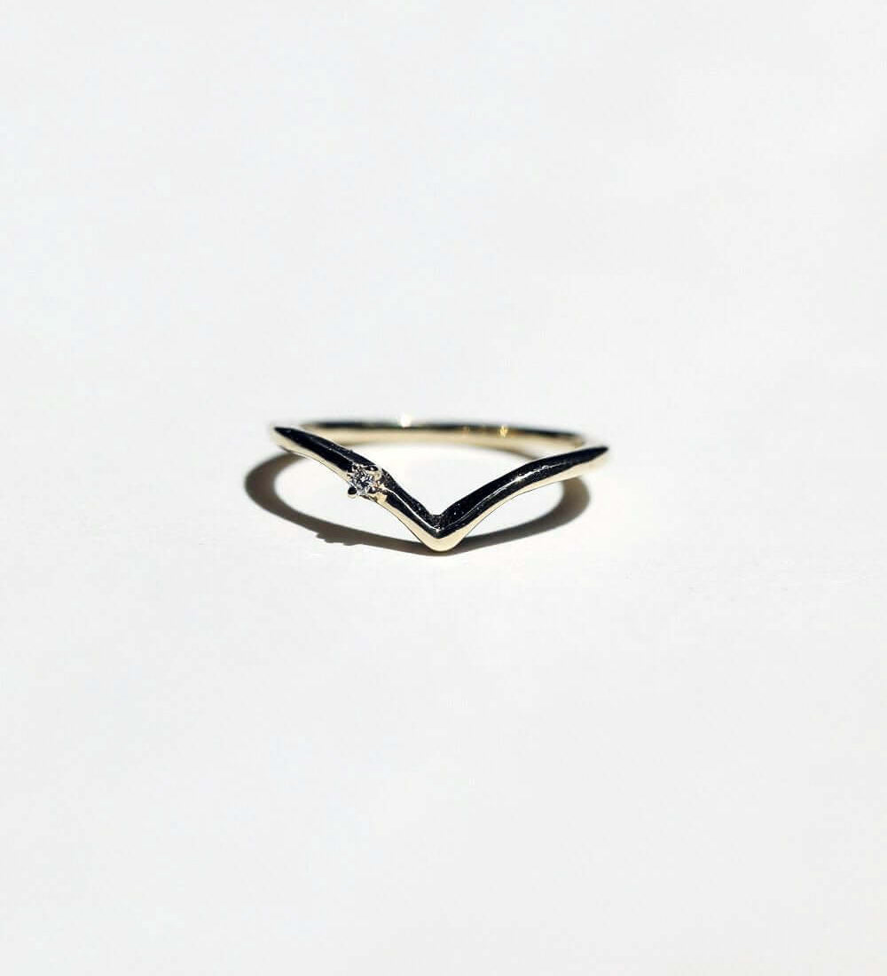 V shaped 14k yellow gold band with tiny white diamond macha studio brooklyn new york
