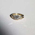 semi-translucent salt n pepper diamond engagement ring accented by white tapered baguettes set in 14k gold band macha studio brooklyn new york