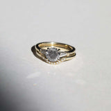 semi-translucent salt n pepper diamond engagement ring accented by white tapered baguettes set in 14k gold band macha studio brooklyn new york