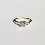 semi-translucent salt n pepper diamond engagement ring accented by white tapered baguettes set in 14k gold band macha studio brooklyn new york