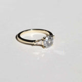 semi-translucent salt n pepper diamond engagement ring accented by white tapered baguettes set in 14k gold band macha studio brooklyn new york