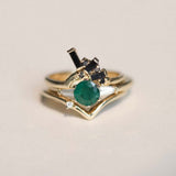 Round cut emerald engagement ring 14k yellow gold white baguette diamonds handcrafted macha studio brooklyn new york