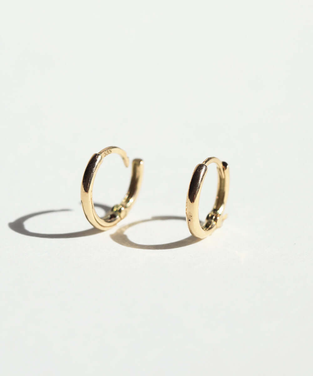 mini hinged huggies gold earrings Brooklyn New York 