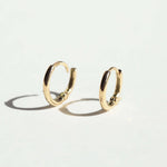 mini hinged huggies gold earrings Brooklyn New York 