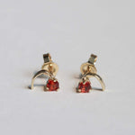 round cut orange sapphires set in 14k yellow gold earrings handcrafted macha studio brooklyn new york