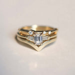 Emerald cut 0.5ct white diamond, with white diamond baguettes set in 14k yellow gold