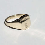 small 14k yellow gold signet ring with rounded square face featuring British hallmarks and date letter 'w' handcrafted macha studio brooklyn new york