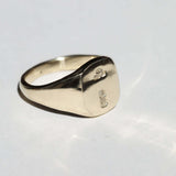 small 14k yellow gold signet ring with rounded square face featuring British hallmarks and date letter 'w' handcrafted macha studio brooklyn new york