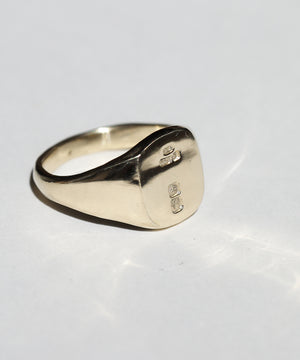 small 14k yellow gold signet ring with rounded square face featuring British hallmarks and date letter 'w' handcrafted macha studio brooklyn new york