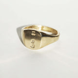 small 14k yellow gold signet ring with rounded square face featuring British hallmarks and date letter 'w' handcrafted macha studio brooklyn new york