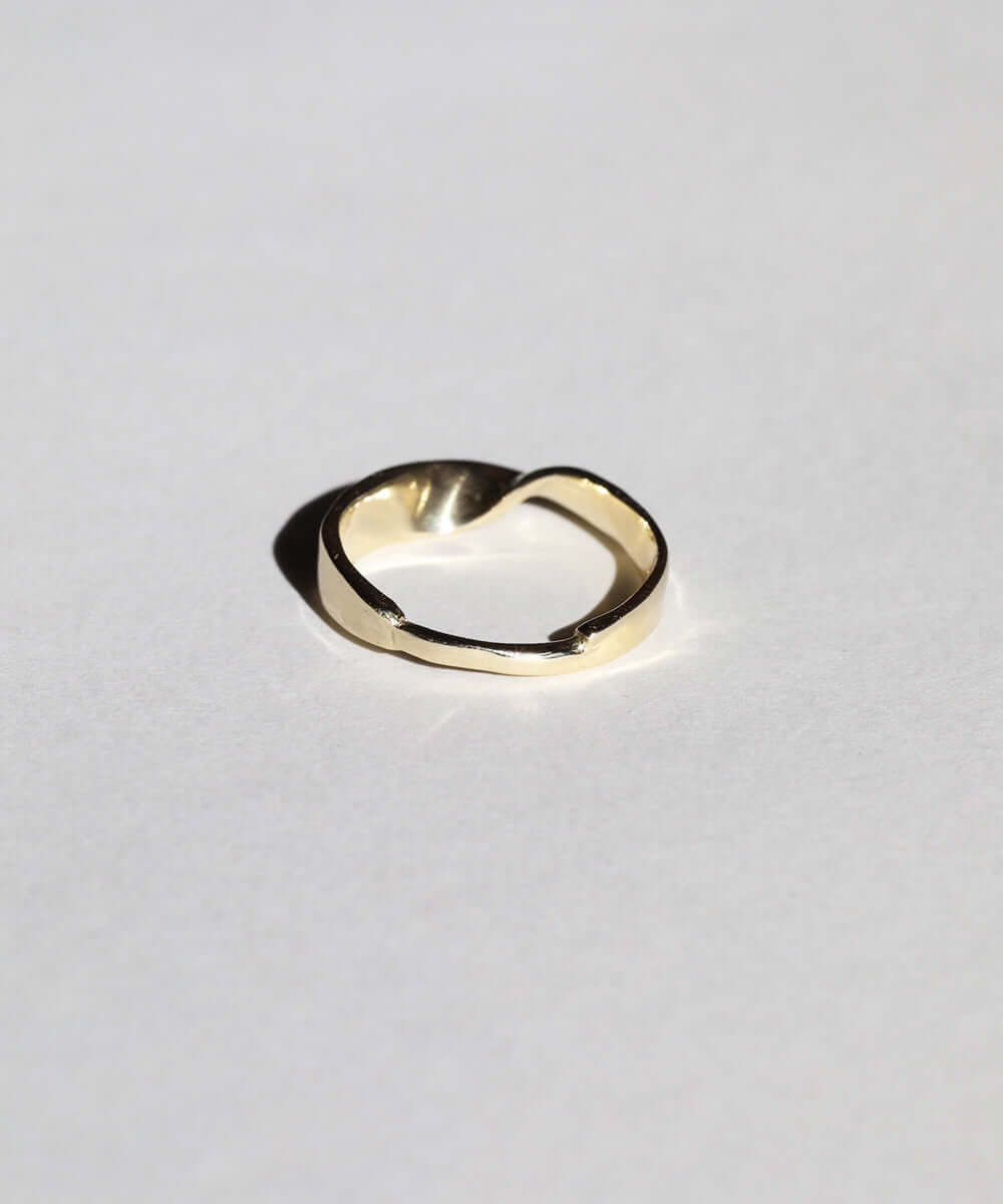 wide 14k gold band with twisted feature and narrow back macha studio brooklyn new york