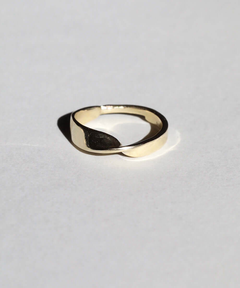 wide 14k gold band with twisted feature and narrow back macha studio brooklyn new york