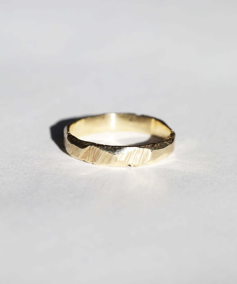 handmade 14k yellow gold band with ragged texture macha studio brooklyn new york