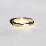 handmade 14k yellow gold band with ragged texture macha studio brooklyn new york