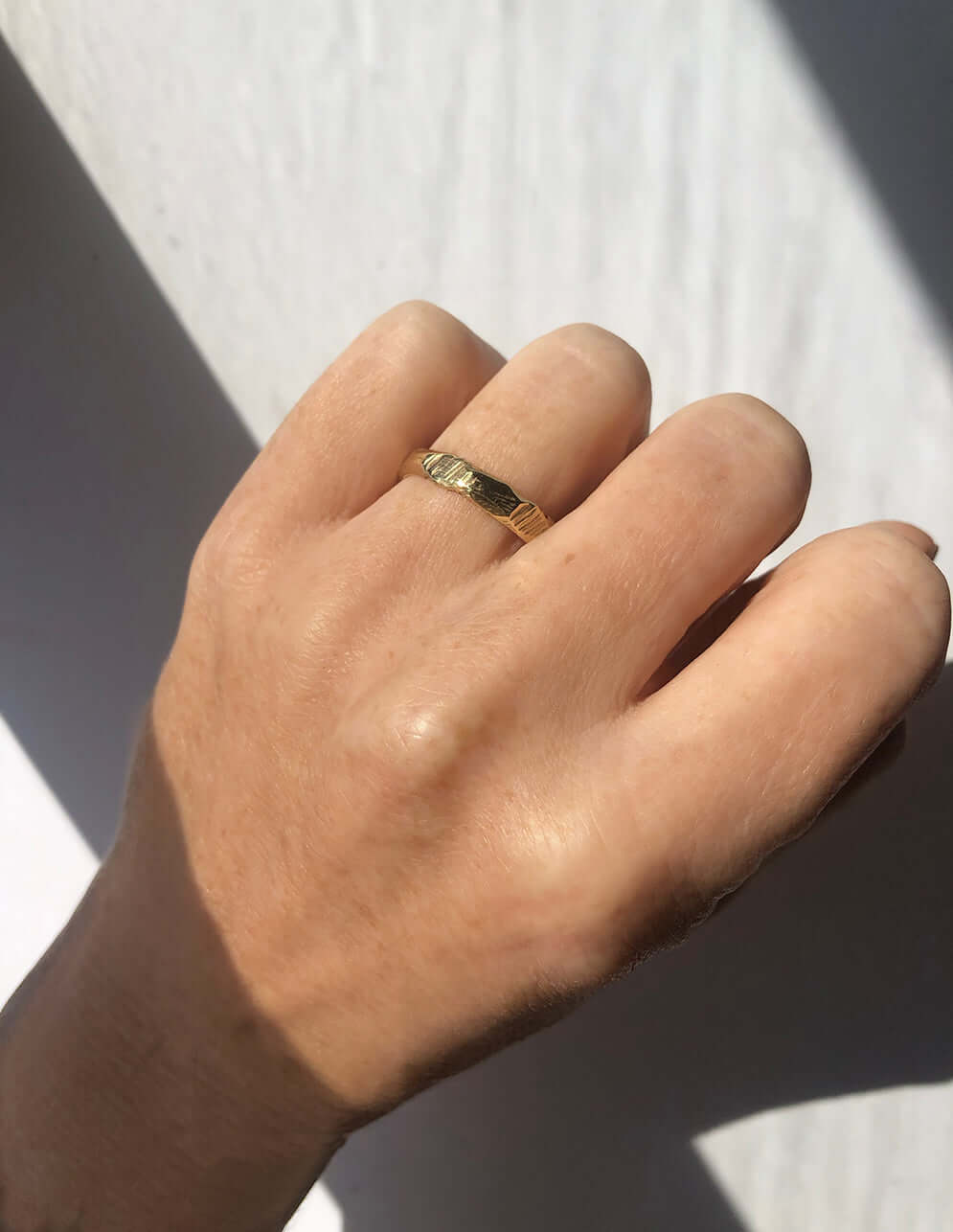 handmade 14k yellow gold band with ragged texture macha studio brooklyn new york